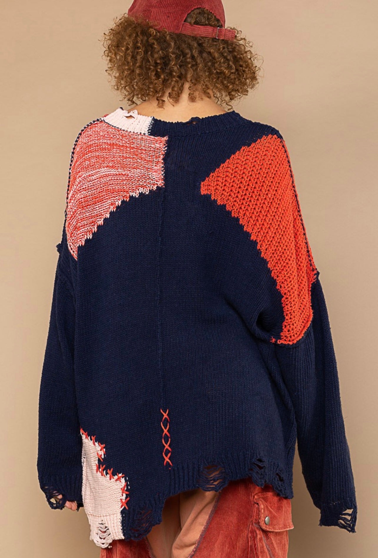 Designed in Distressed Sweater