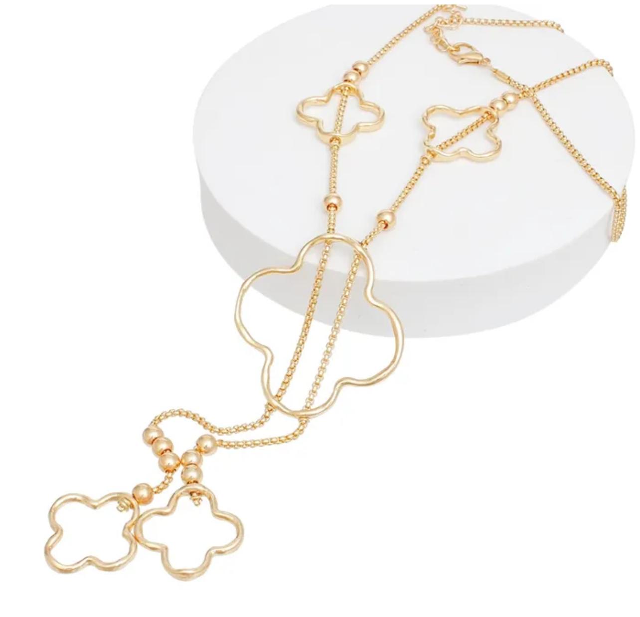Long Gold Quatrefoil Negligee Necklace

Dripping in Elegance